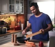 happy-man-cooking-in-kitchen-2021-08-26-20-15-40-utc-Custom.jpg