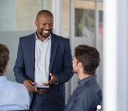 mature-business-man-in-meeting-smiling-2021-08-27-09-44-05-utc-Custom.jpg